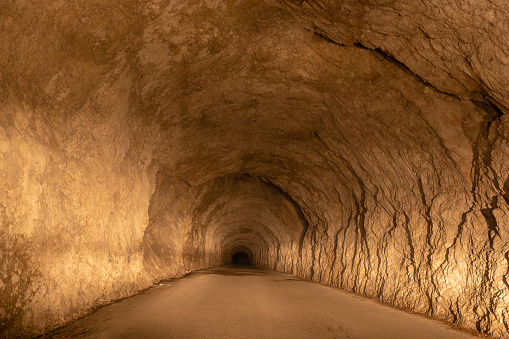 rock road tunnel in the alps