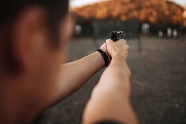 istock Shooting from handgun, personal point of view, close-up. 1179956428