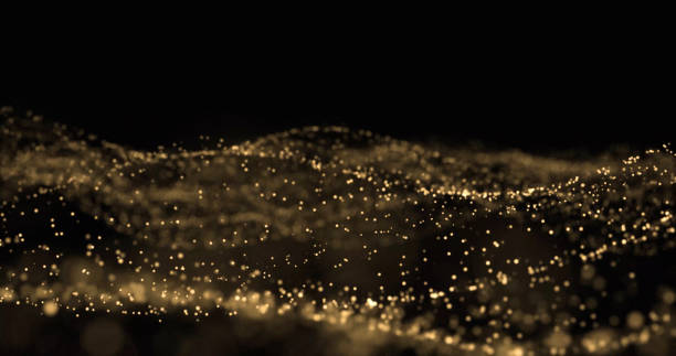 istock Golden glitter, light particles wave, golden sparks glow and light wave with bokeh shimmer on black background 1179956590