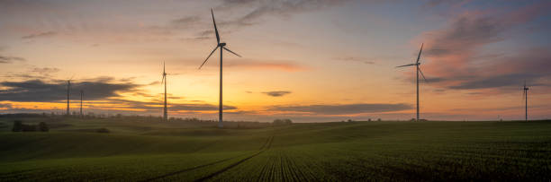 istock windmills on a field in Germany during a beautiful multicolored sunrise 1179957811