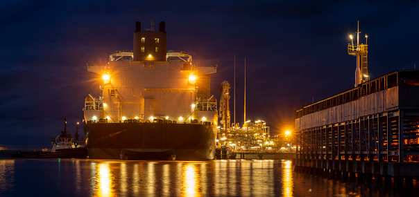 LNG tanker during the night supply of liquefied gas at the LNG terminal