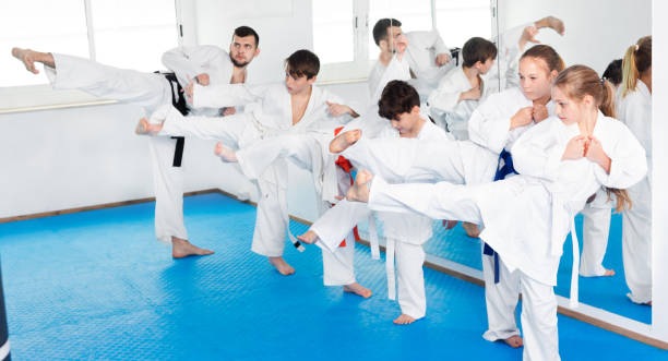 istock Children trying martial moves in karate class 1179959900