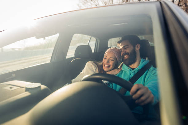 istock Young happy couple going on a road trip by car. 1179961090