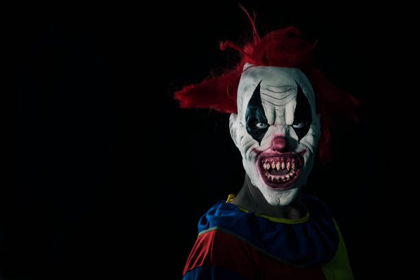 istock scary evil clown with a bloody mouth 1179961364