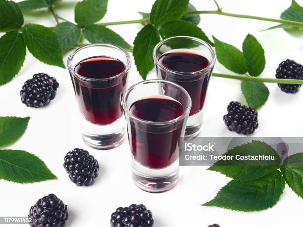 Three Glasses Of Blackberry Liqueur Also Known As Creme De Mure Stock Photo - Download Image Now