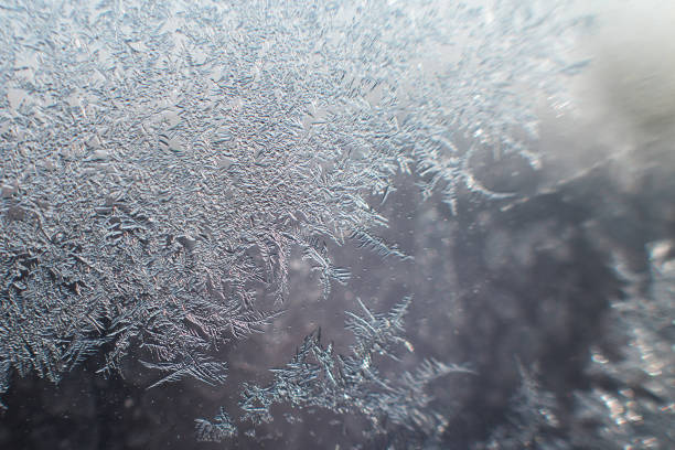 istock snow pattern on the glass from frost 1179961752