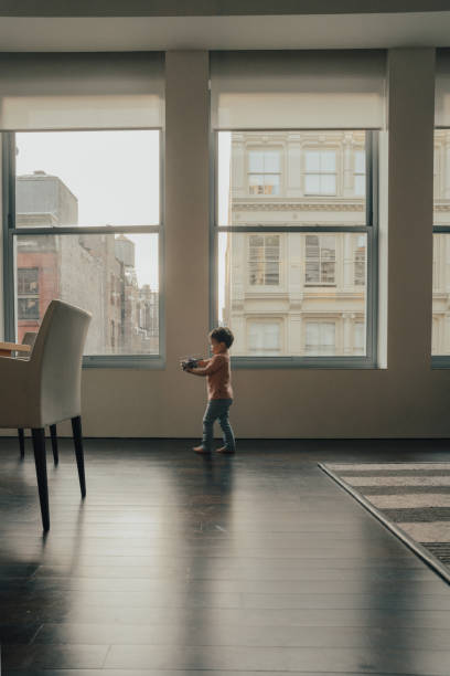 istock Boy playing at New York Apartment 1179962886