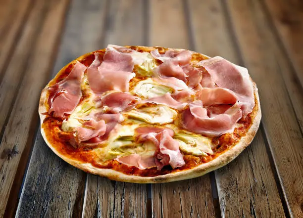 Pizza Fantasia on a textured wooden table