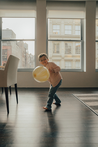 Boy playing at New York Apartment