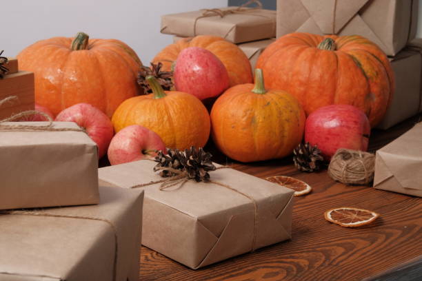 istock Gift boxes with pumpkins garlands holiday concept. 1179963007