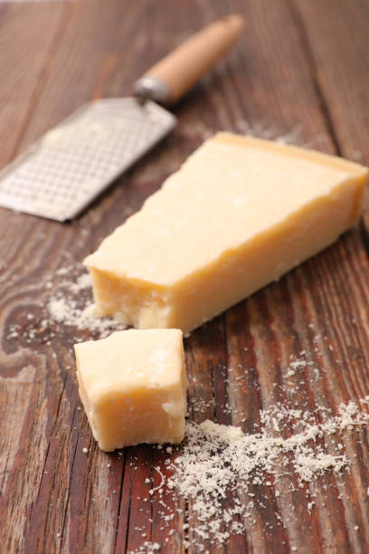 istock parmesan cheese portion on wood background 1179964281