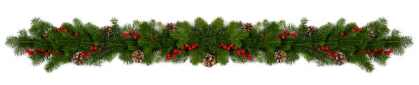 Christmas frame of tree branches Christmas Border frame of tree branches red berries and pine cones on white background with copy space isolated evergreen garland stock pictures, royalty-free photos & images