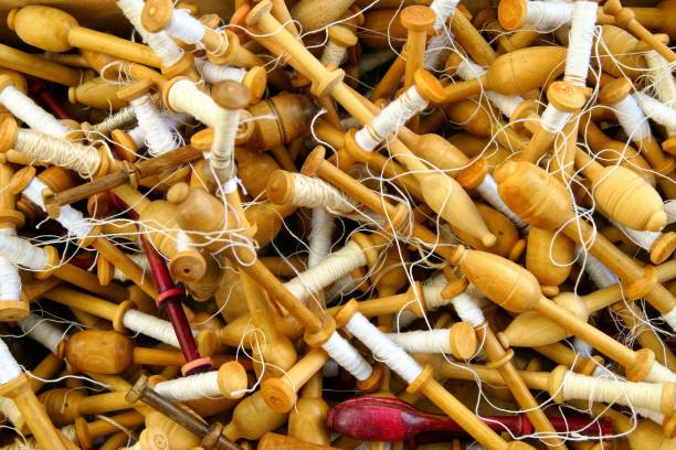 istock Old retro wool spindle and yarn. Coil with coiled spindle for spinning wheel 1179964675