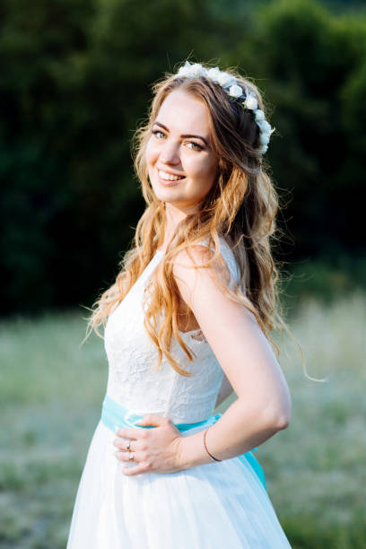 istock bride posing for the photographer on the nature 1179968564