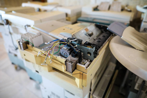 istock Shallow depth of field image with electronic and mechanical components of an old multifunction printer 1179969282