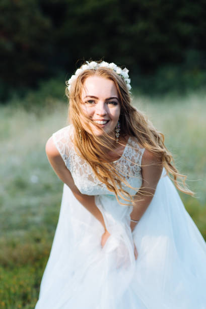 istock bride posing for the photographer on the nature 1179969682
