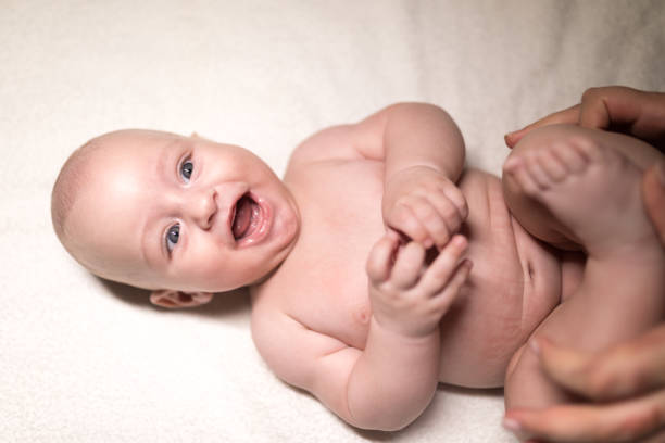 istock Baby exercising on the bed 1179970990