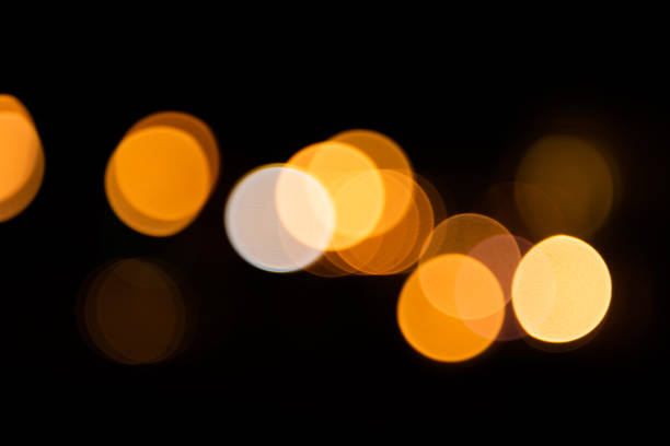 istock Colorful city lights with bokeh effect reflected over sea background at dusk 1179971392