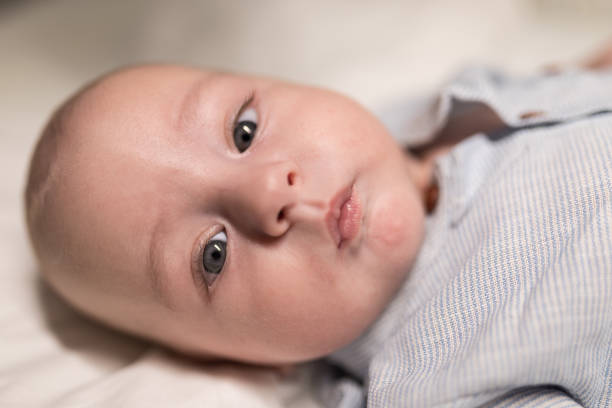 istock Cute baby boy with blue eyes 1179971446