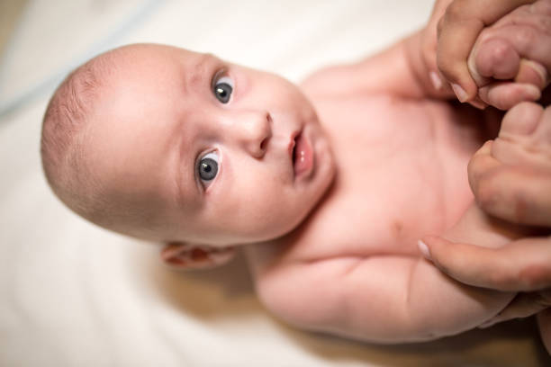 istock Baby exercising on the bed 1179971506
