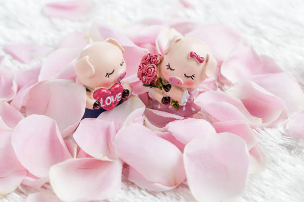 istock Two piglets in a rose petal 1179973692