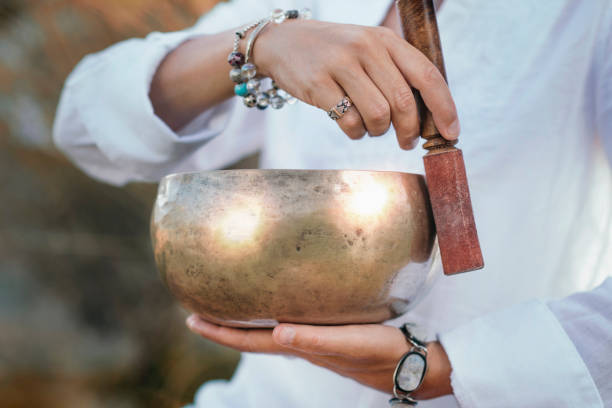 Sound Therapy with Tibetan Singing Bowl Tibetan singing bowl in sound therapy close up gong stock pictures, royalty-free photos & images