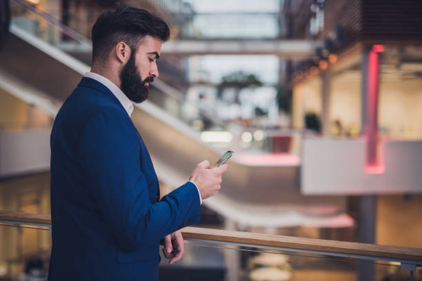 istock Businessman texting about cryptocurrency and value of bitcoin with his broker 1179979365