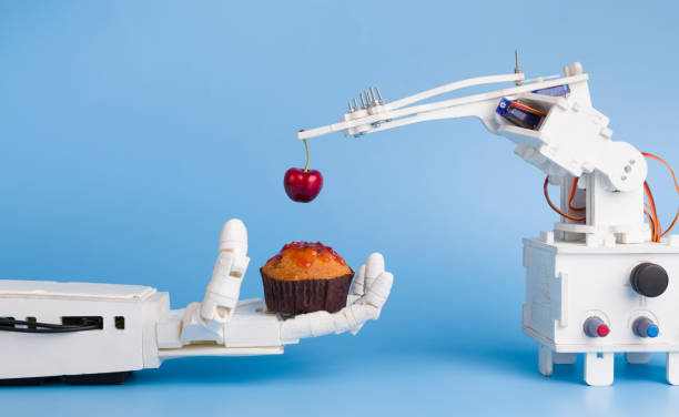 AI technology preparing sweet cupcake with fresh cherry Automatization at kitchen. AI technology preparing sweet cupcake with fresh cherry, blue background with free space telegram machine photos stock pictures, royalty-free photos & images