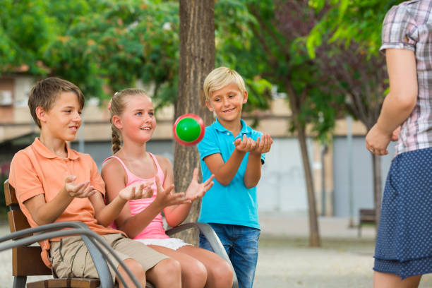 istock Cheerful children are playing with ball 1179987310