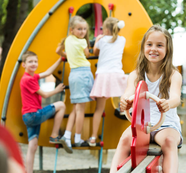 istock Glad girl sitting on swing toy 1179987398