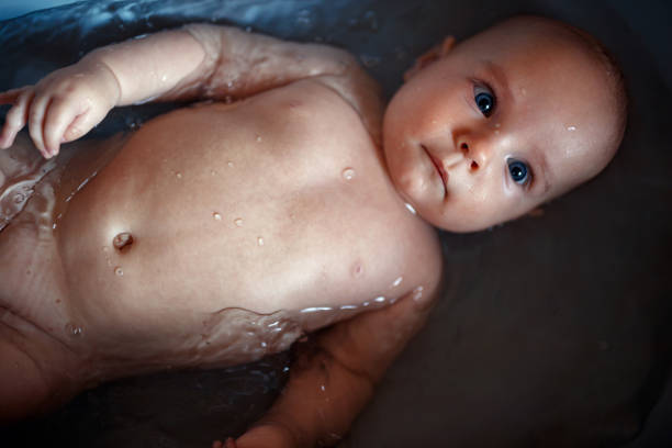 istock Little baby boy taking bath. Baby in the bath 1179987489