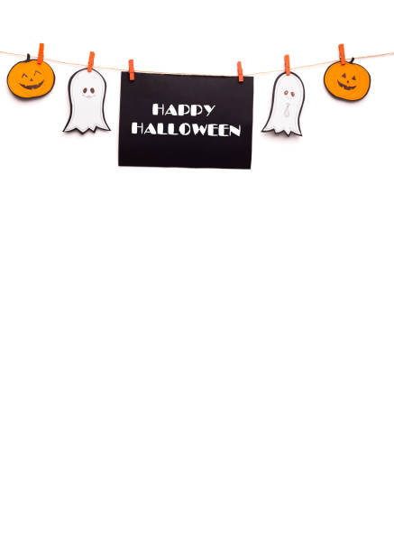 Creative Happy Halloween text hanging out on rope with funny paper figures on white, copy space, vertical panorama
