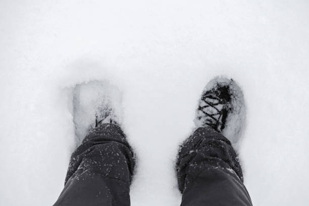 istock Male feet in deep snow 1179991077