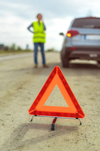 istock Vehicle breakdown and warning triangle on the road 1179991203