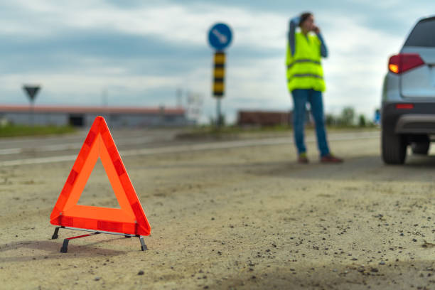 istock Vehicle breakdown and warning triangle on the road 1179991259