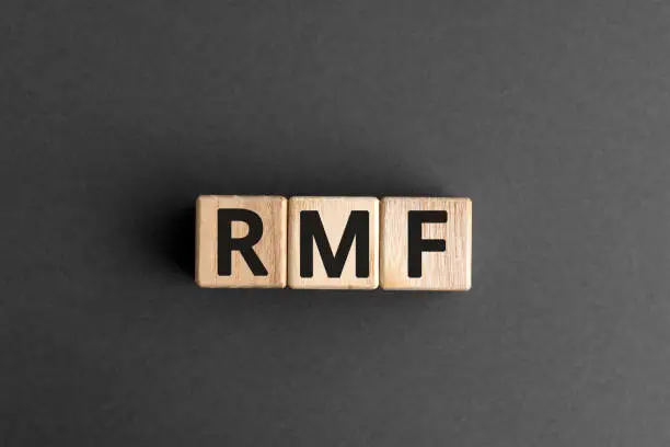 RMF - acronym from wooden blocks with letters, abbreviation LTF Long-Term Equity Mutual Fund and RMF Retirement Mutual Fund concept, gray background