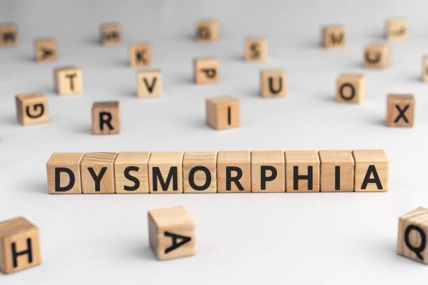 istock Dysmorphia - word from wooden blocks with letters 1179991740