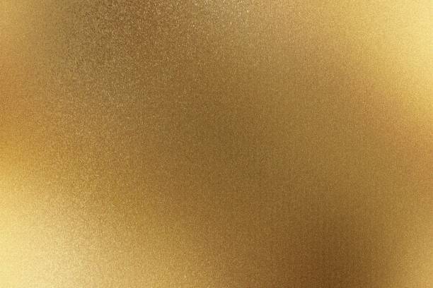 istock Shiny brushed gold metallic wall with scratched surface, abstract texture background 1179993108