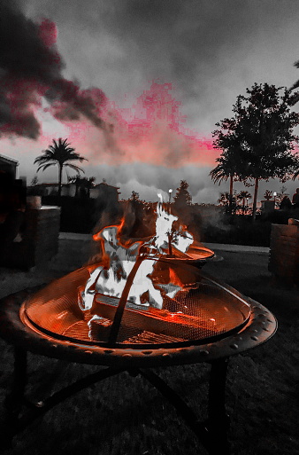 Night view of fire pit in the tropics black and red