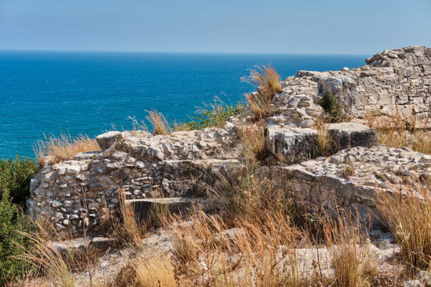 ruins of sanctuary of apollo hylates located at the beach of mediterranean sea. near an ancient greek town of kourion. limassol, episkopi, cyprus - sanctuary of apollo international landmark sunny sunlight imagens e fotografias de stock