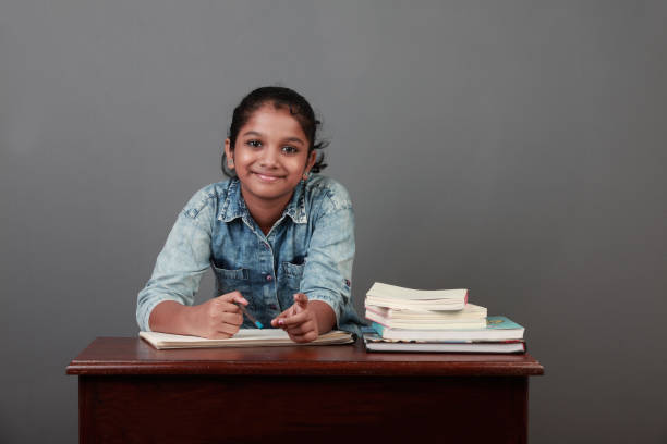 Young girl with her books in the study room