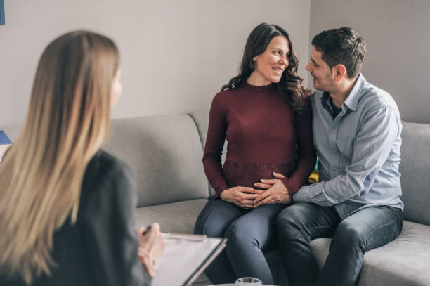 istock Expecting couple on home counselling meeting 1180010646
