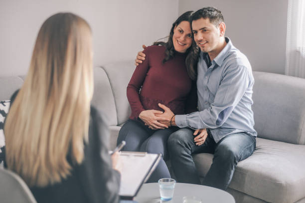 istock Expecting couple on home counselling meeting 1180010690