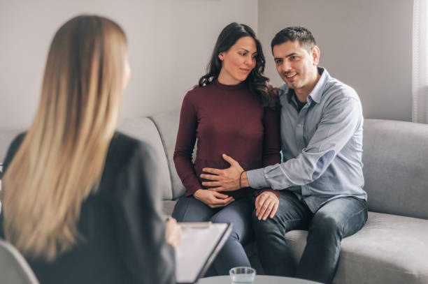 istock Expecting couple on home counselling meeting 1180010700