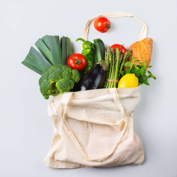 istock Mesh bag with fruits, vegetables. Zero waste, plastic free concept 1180010939