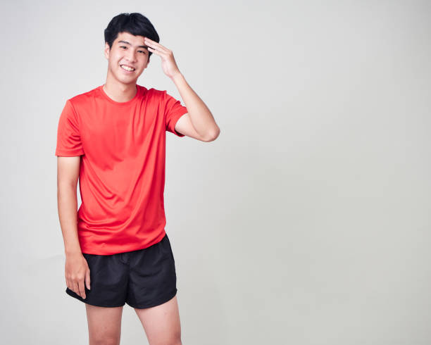 istock Young man stretching and exercising in sportswear on white background 1180011296