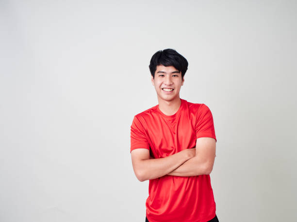 istock Young man stretching and exercising in sportswear on white background 1180011362