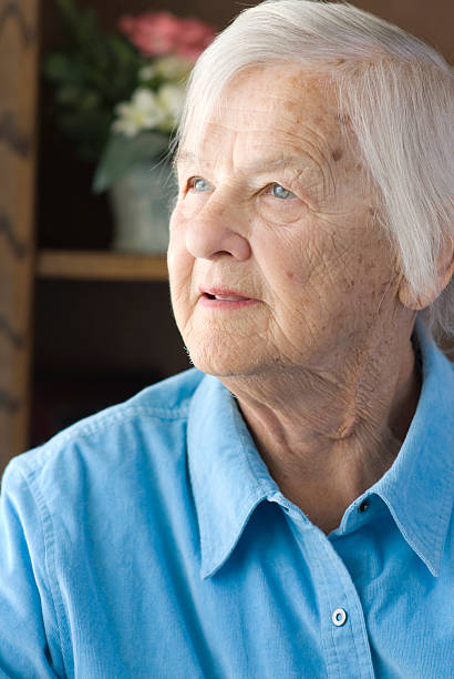 istock Senior woman at window 118001155