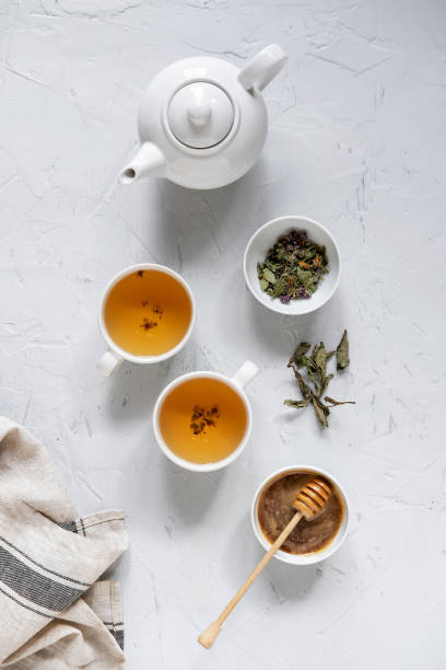 istock Floral green tea on table with tea kettle and napkin 1180012648