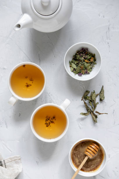 istock Floral green tea on table with tea kettle and napkin 1180012655